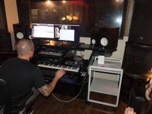 Spanish language version of 'Bad Guys' by Gone Marshall being recorded in Florida, USA
